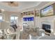 Inviting living room with a fireplace, a decorative aquarium, hardwood floors and comfortable seating at 4009 Ballovista Rd, Johns Island, SC 29455