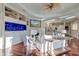 Bright living room featuring a large aquarium, fireplace, and hardwood floors leading to the kitchen at 4009 Ballovista Rd, Johns Island, SC 29455