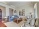 Bright living room with hardwood floors, comfortable seating, and decorative mirrors at 4009 Ballovista Rd, Johns Island, SC 29455