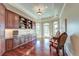 Office space with built-in shelving, ample storage, and hardwood floors at 4009 Ballovista Rd, Johns Island, SC 29455