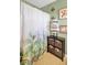 Bathroom features shower/tub, shower curtain, shelving for towels, and artwork on the walls at 402 Pine Bluff Dr, Summerville, SC 29483