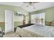 Bedroom has a ceiling fan, large window for natural light, and television at 402 Pine Bluff Dr, Summerville, SC 29483