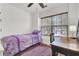 Cozy bedroom with a single bed, a desk near the window, and a plush purple rug on the wood floor at 402 Pine Bluff Dr, Summerville, SC 29483