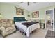 Spacious bedroom boasts a ceiling fan and a large window for natural light at 402 Pine Bluff Dr, Summerville, SC 29483