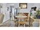Cozy dining room with hardwood floors, a chandelier, and a bright window at 402 Pine Bluff Dr, Summerville, SC 29483
