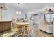 Bright dining area featuring chandelier lighting, hardwood floors, and comfortable seating at 402 Pine Bluff Dr, Summerville, SC 29483