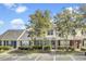 Charming townhome with well-maintained landscaping, inviting entrance, and dedicated parking spaces at 402 Pine Bluff Dr, Summerville, SC 29483