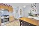 Kitchen with cabinets, countertops, tile backsplash, oven, island, and hard wood flooring at 402 Pine Bluff Dr, Summerville, SC 29483