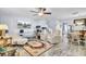 Bright living room with wood floors, ceiling fan, modern furniture, and entertainment center at 402 Pine Bluff Dr, Summerville, SC 29483