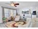 Inviting living area featuring cozy seating, sheer curtains, and a modern entertainment setup at 402 Pine Bluff Dr, Summerville, SC 29483