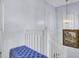 Carpeted staircase with white banister beneath a hanging light fixture and landscape painting at 402 Pine Bluff Dr, Summerville, SC 29483