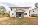 Back exterior of house featuring a screened-in back porch at 413 Renau Blvd, Summerville, SC 29483