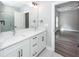 Bathroom boasts a double sink vanity with modern fixtures and a large mirror at 413 Renau Blvd, Summerville, SC 29483
