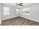 Bright bedroom with hardwood floors, multiple windows, and ceiling fan at 413 Renau Blvd, Summerville, SC 29483