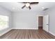 Spacious bedroom features sleek ceiling fan, modern lighting, and wood-look flooring at 413 Renau Blvd, Summerville, SC 29483
