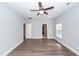 Light-filled bedroom boasts attractive ceiling fan and door to ensuite bathroom or closet at 413 Renau Blvd, Summerville, SC 29483