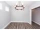 Cozy dining area with chandelier, neutral walls, and durable hardwood floors at 413 Renau Blvd, Summerville, SC 29483