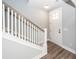 Bright entryway featuring hardwood floors, a white staircase, and natural light at 413 Renau Blvd, Summerville, SC 29483