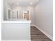 Hallway with hardwood floors and access to a bathroom at 413 Renau Blvd, Summerville, SC 29483
