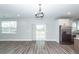 Bright living area with sliding glass doors, hardwood floors, and stainless steel refrigerator at 413 Renau Blvd, Summerville, SC 29483