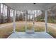 Screened patio offers a peaceful outdoor retreat with views of the wooded backyard at 413 Renau Blvd, Summerville, SC 29483