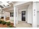 Inviting front porch with classic columns and a dark wood front door at 413 at 413 Renau Blvd, Summerville, SC 29483