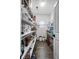 Walk-in pantry with plenty of storage shelving for an organized kitchen at 414 Sanctuary Park Dr, Summerville, SC 29486