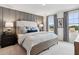 Serene main bedroom featuring plush bedding, elegant lamps, and soft, neutral colors at 4159 Rising Tide Dr, Summerville, SC 29485