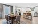 A dining room and kitchen area showcasing stainless steel appliances and natural light at 4183 Rising Tide Dr, Summerville, SC 29485