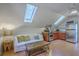 Cozy living area with vaulted ceiling and skylights at 4462 Francis Yonge Way, Hollywood, SC 29449