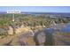 Stunning aerial view of the property showcasing its waterfront location and surrounding landscape at 4462 Francis Yonge Way, Hollywood, SC 29449