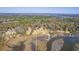 Aerial view of multiple waterfront homes with private docks on a marshy river at 4462 Francis Yonge Way, Hollywood, SC 29449