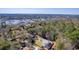 Aerial view of secluded homes with expansive yards nestled among a dense forest landscape at 4462 Francis Yonge Way, Hollywood, SC 29449