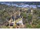 Aerial shot showcases the waterfront property surrounded by lush, mature trees at 4462 Francis Yonge Way, Hollywood, SC 29449