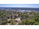 Aerial view of the marsh and waterfront property features private docks, with many trees at 4462 Francis Yonge Way, Hollywood, SC 29449