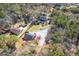 Aerial view of several homes with green lawns, surrounded by lush, mature trees at 4462 Francis Yonge Way, Hollywood, SC 29449