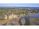 Stunning aerial view of homes with docks along the water, surrounded by lush greenery at 4462 Francis Yonge Way, Hollywood, SC 29449