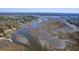 An aerial view of the expansive marsh and waterfront property with private docks at 4462 Francis Yonge Way, Hollywood, SC 29449