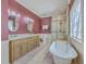 Luxurious bathroom with a standalone tub, dual vanities, and a glass-enclosed shower at 4462 Francis Yonge Way, Hollywood, SC 29449