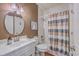 Cozy bathroom with white tiled shower and unique lighting at 4462 Francis Yonge Way, Hollywood, SC 29449