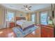 Serene bedroom with hardwood floors, ceiling fan and abundant natural light at 4462 Francis Yonge Way, Hollywood, SC 29449