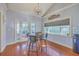 Bright and airy dining area with hardwood floors and views of the backyard at 4462 Francis Yonge Way, Hollywood, SC 29449