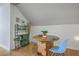 Cozy dining area featuring a wooden table, stylish blue chairs, and a unique green storage cabinet at 4462 Francis Yonge Way, Hollywood, SC 29449