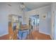 Traditional dining room with hardwood floors and view of the kitchen and living room at 4462 Francis Yonge Way, Hollywood, SC 29449