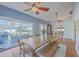 Bright dining room with bench seating, ceiling fan and access to the backyard at 4462 Francis Yonge Way, Hollywood, SC 29449