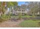 Charming two-story home with a double front porch and lush landscaping at 4462 Francis Yonge Way, Hollywood, SC 29449