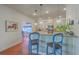 Kitchen includes custom white cabinets, granite countertops, stainless steel appliances, and pendant lighting at 4462 Francis Yonge Way, Hollywood, SC 29449