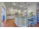 A kitchen with granite countertops, stainless steel appliances, and hardwood floors at 4462 Francis Yonge Way, Hollywood, SC 29449