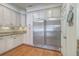 Bright kitchen featuring custom cabinets, granite countertops, and stainless steel refrigerator at 4462 Francis Yonge Way, Hollywood, SC 29449