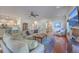 Bright living room featuring hardwood floors, a fireplace, and an open floor plan at 4462 Francis Yonge Way, Hollywood, SC 29449